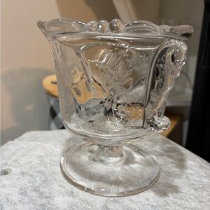 This is a vintage Heisey Orchid covered candy dish with seahorse handles.